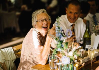 happy wedding guest at chiddingstone castle wedding